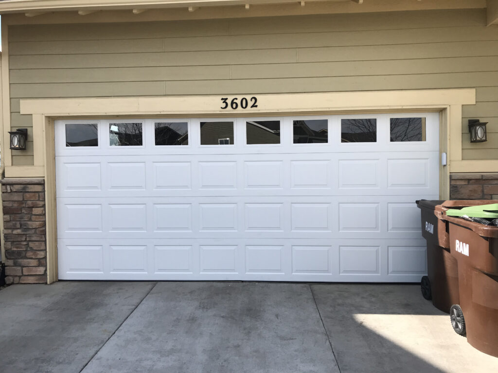 White standard garage door with square windows