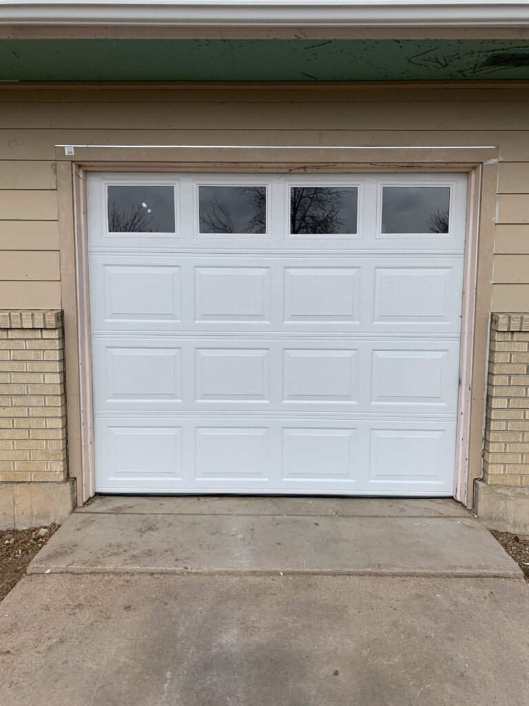 Standard white traditional garage door with windows