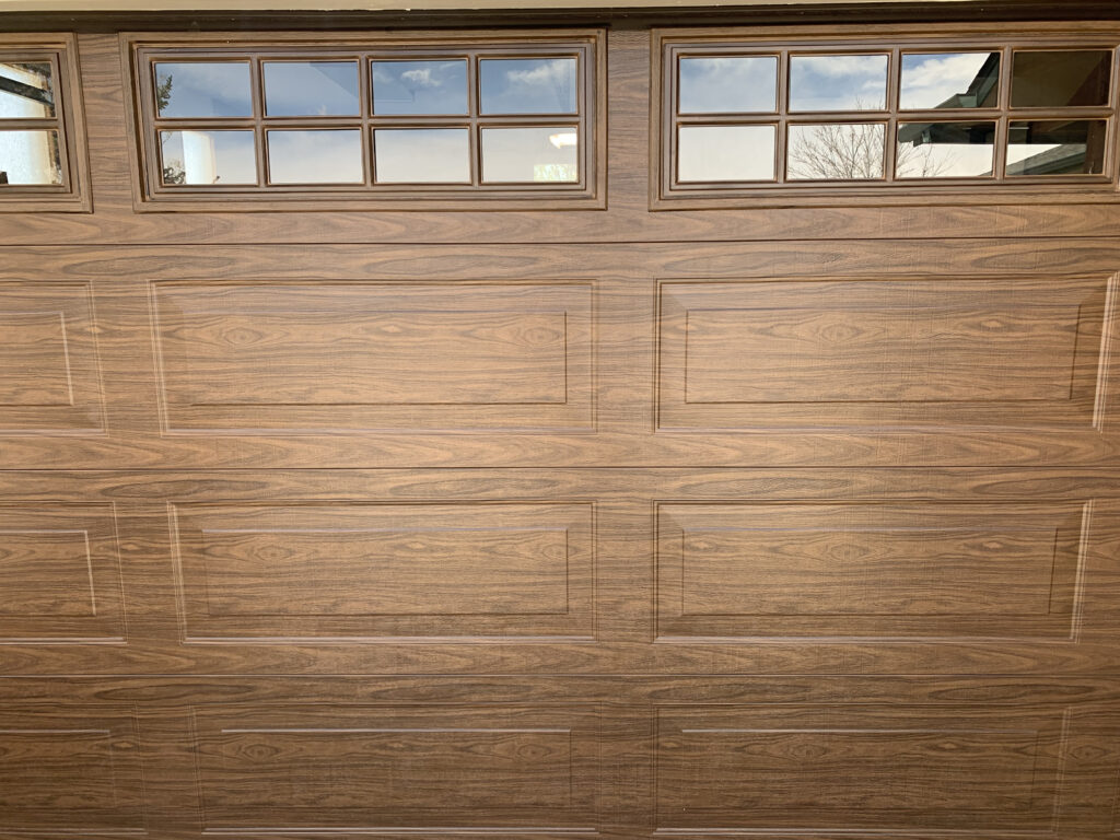 Close-up of a wood tone traditional garage door