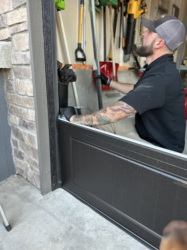 Spring Kings Garage Doors service professional installing a new garage door